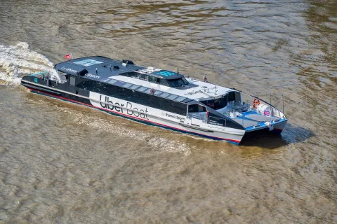 An Uber Thames Clipper ferry boat on the river Thames