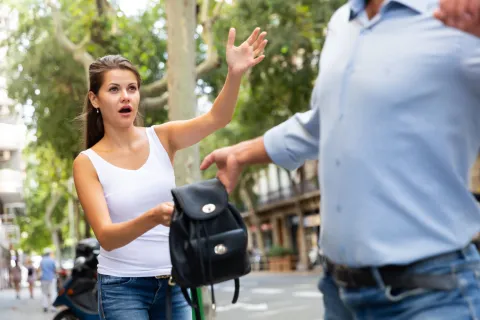 Man street robbery pulling woman backpack on street