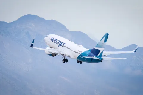 WestJet aircraft C-GWBT Boeing 737-700 taking off from Harry Reid International