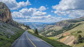 The scenic Beartooth Highway leading to Yellowstone with panoramic views of the surrounding wilderness.