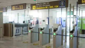 Passport-control gates and EU/EEA citizen signage in an airport terminal