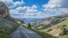 The scenic Beartooth Highway leading to Yellowstone with panoramic views of the surrounding wilderness.
