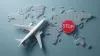 Airplane travel ban symbol with stop sign over world map